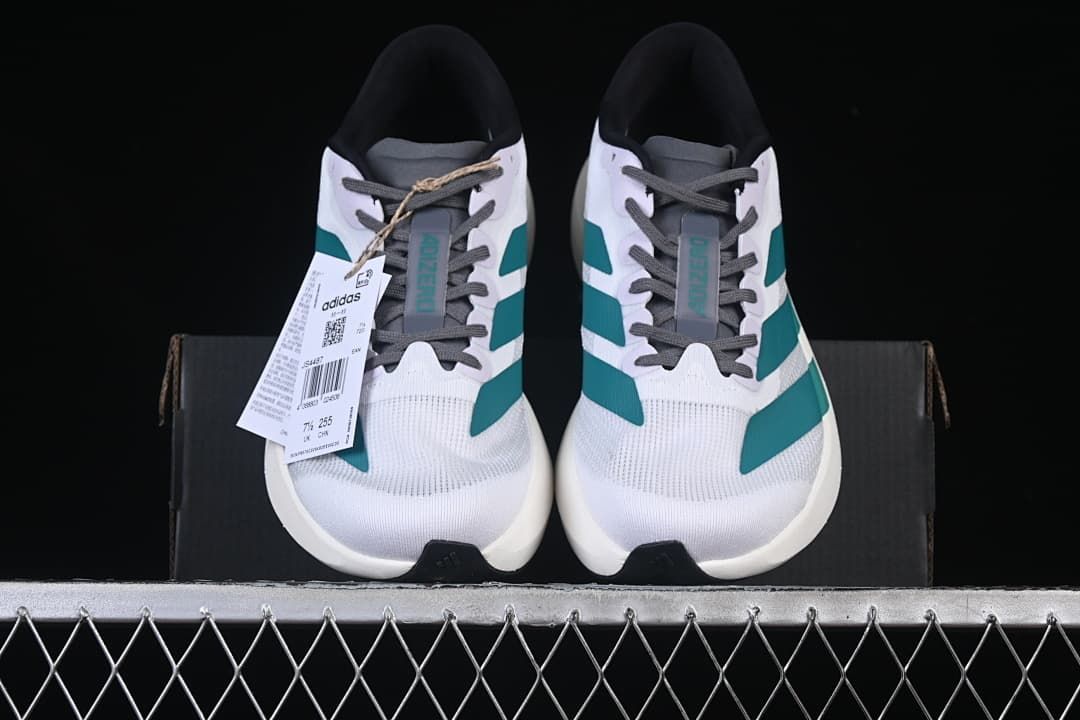 Front view of the pair of running shoes with their product tag visible.