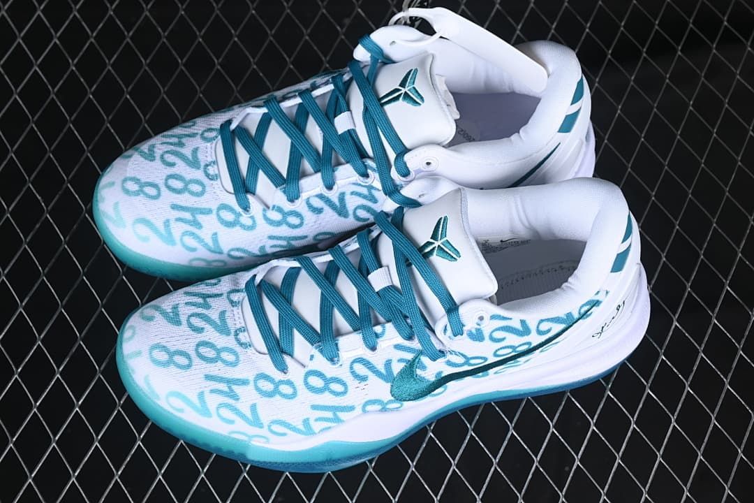 Pair of white and teal Kobe 8 Protro basketball shoes