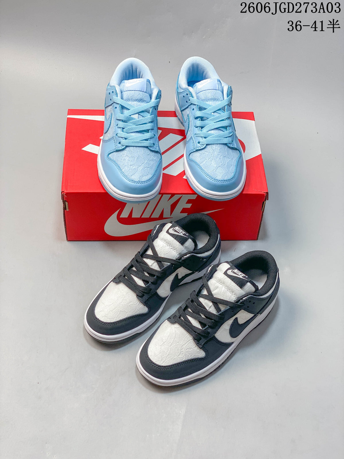 Blue-and-white and black-and-white low-top Nike Dunk sneakers shown together