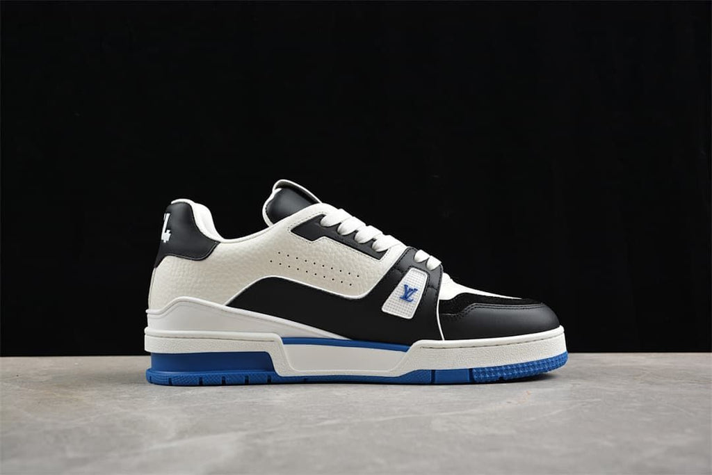 Side profile of a white and black LV Trainer with blue outsole