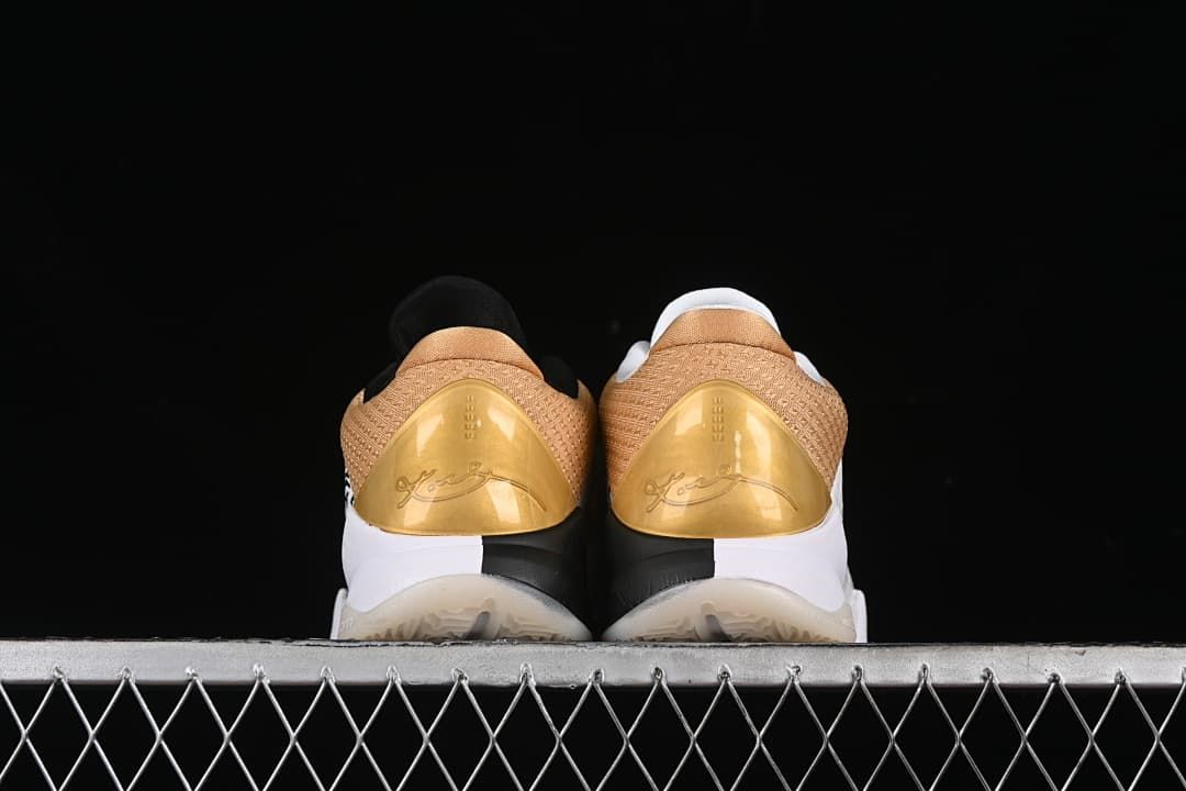 Rear view of the pair showing gold heel panels and Kobe signatures