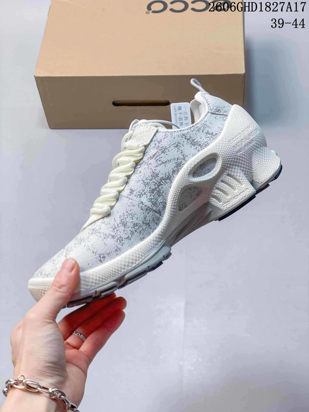 Side view of the patterned ECCO sneaker with elastic-style lacing and sculpted sole.