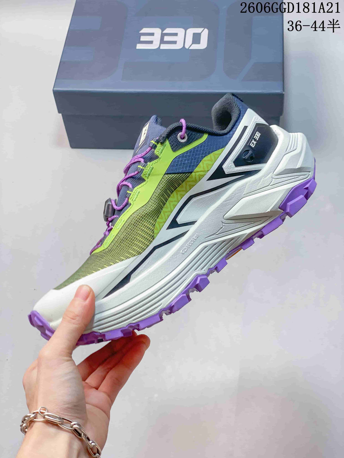 Side view of the trail shoe with green upper, white midsole, and purple outsole; image text shows 36–44.5.