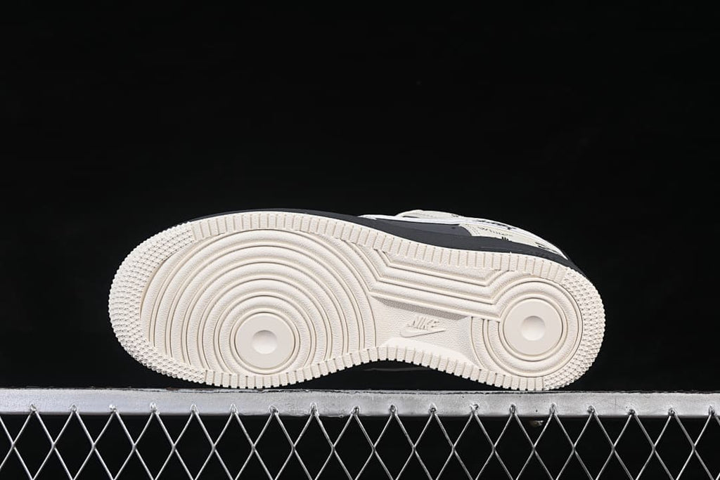Underside view showing the patterned light-colored outsole