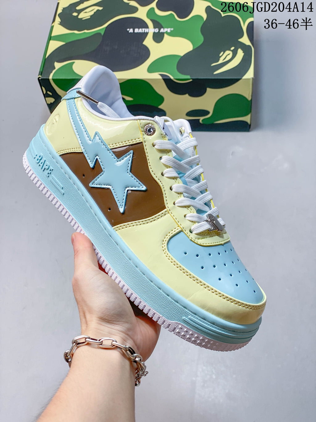 Angled side view highlighting the glossy multicolor panels and star detail on a BAPE STA sneaker