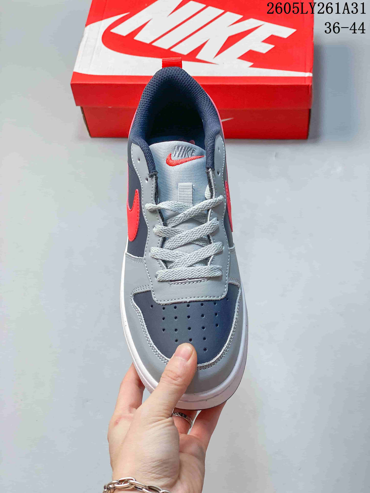 Top view showing the perforated toe, gray laces, and padded navy collar