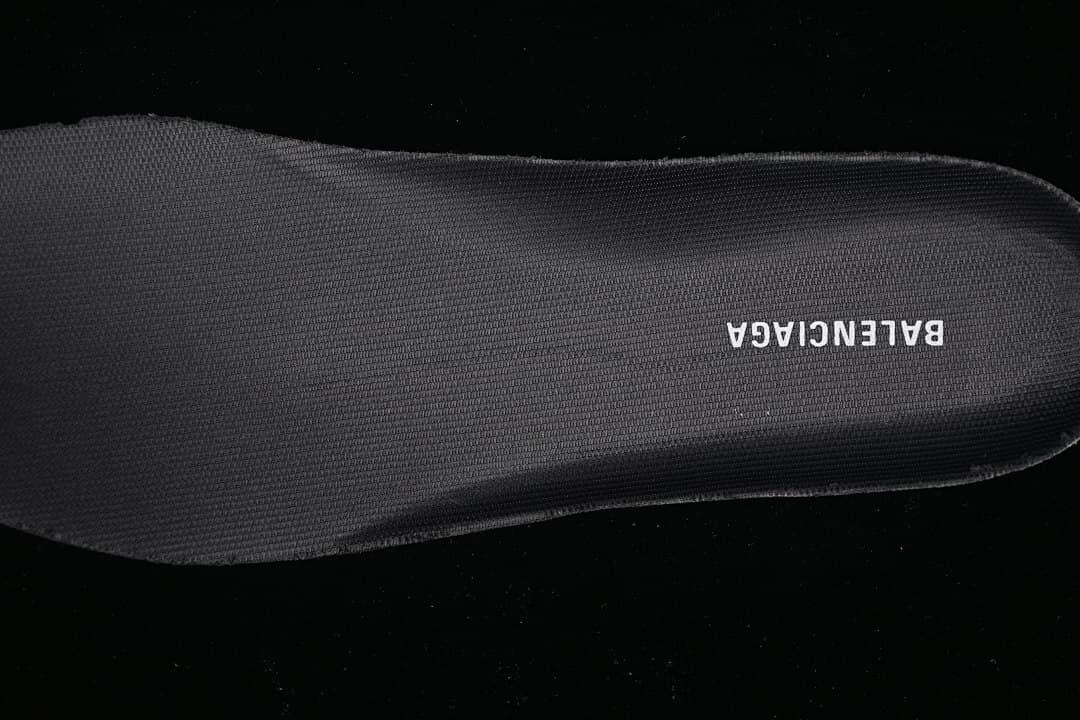 Close-up of a dark insole with Balenciaga lettering