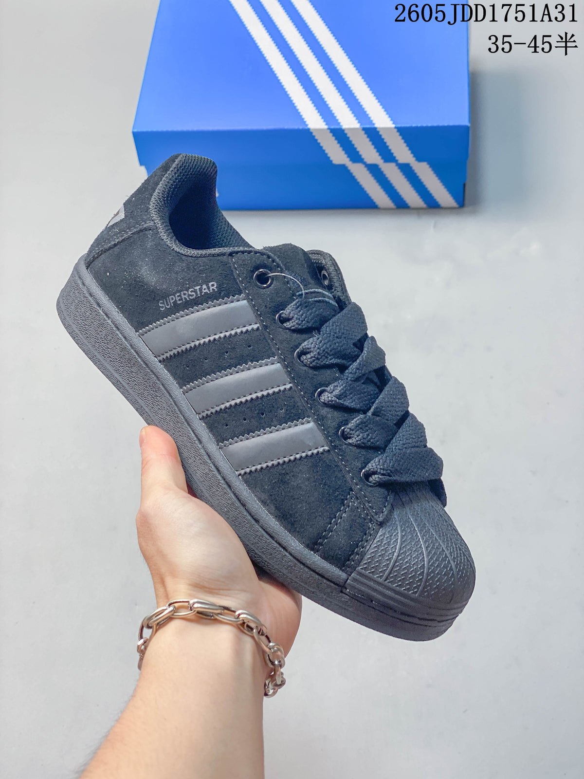 Charcoal Adidas Superstar-style sneaker with gray stripes and a dark shell toe