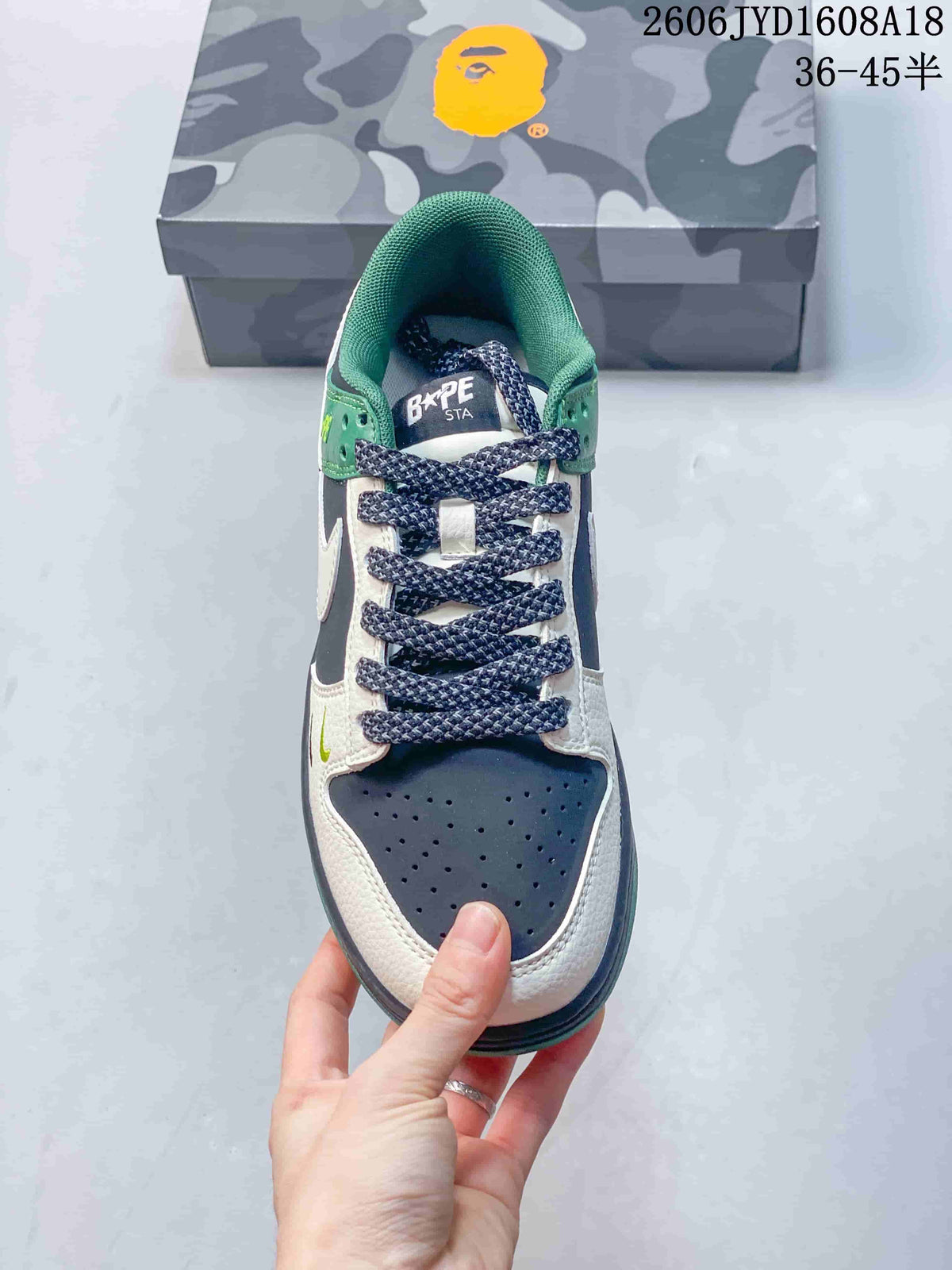 Top view showing the perforated toe, patterned laces, and green collar