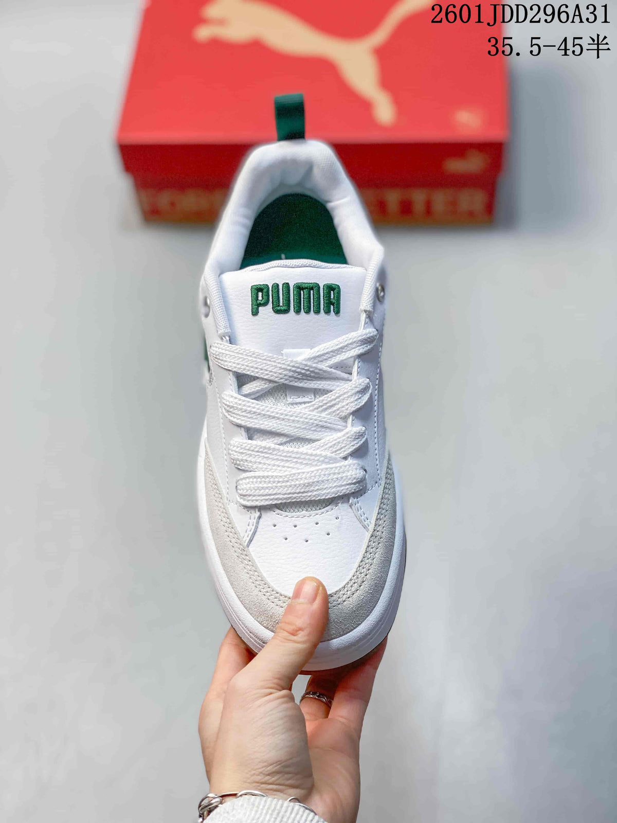 Front view showing white laces, green tongue branding, and light neutral overlays