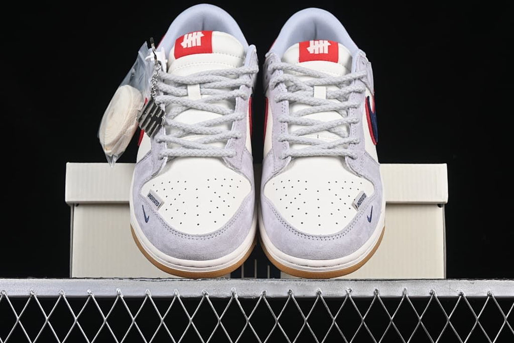 Front view of the pair showing perforated toe boxes, laces and gum-colored outsoles.