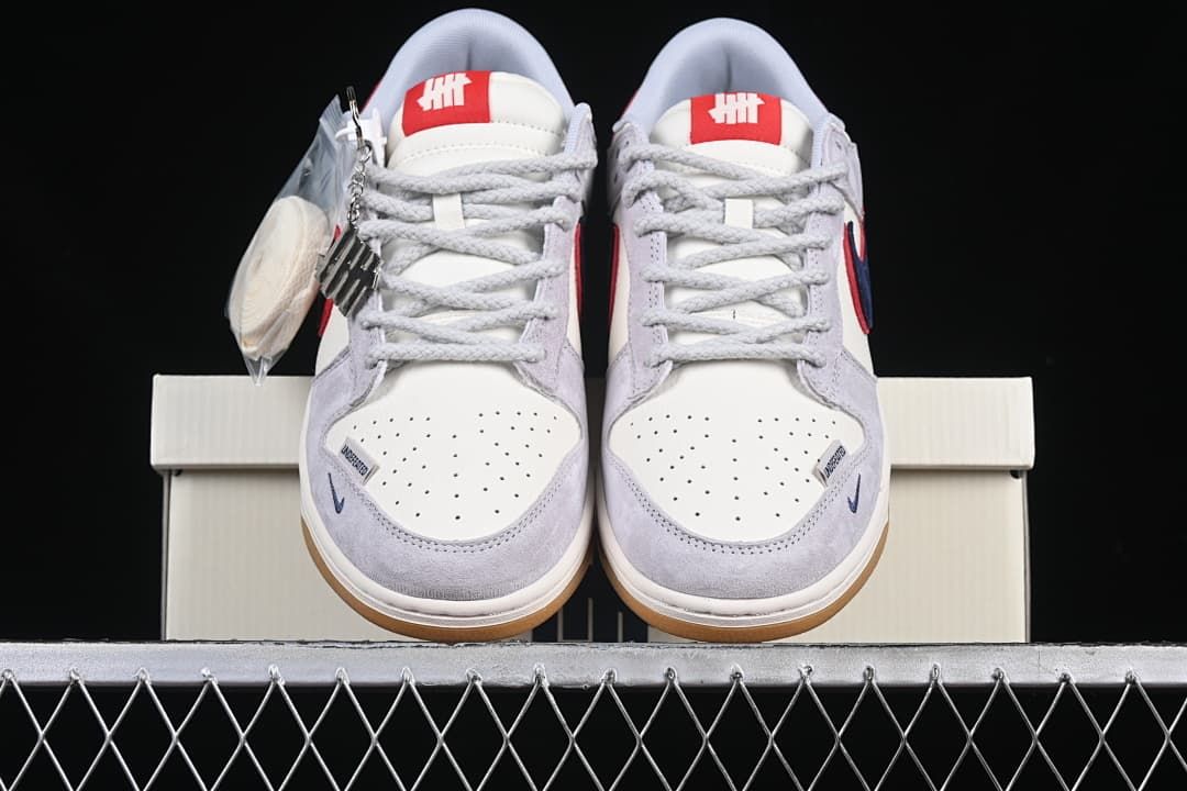 Front view of the pair showing perforated toe boxes, laces and gum-colored outsoles.