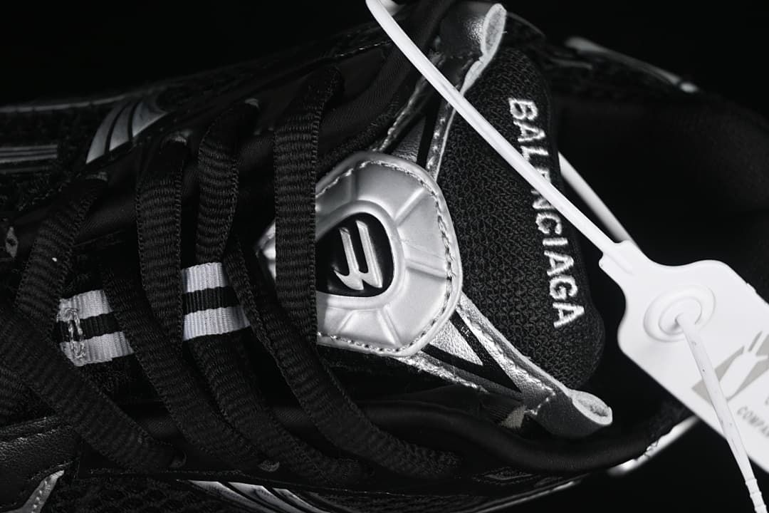 Top-down close-up of the laces, tongue, and mesh toe area.
