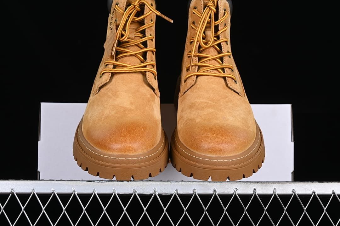 Front view of the pair highlighting the rounded toes and lugged soles