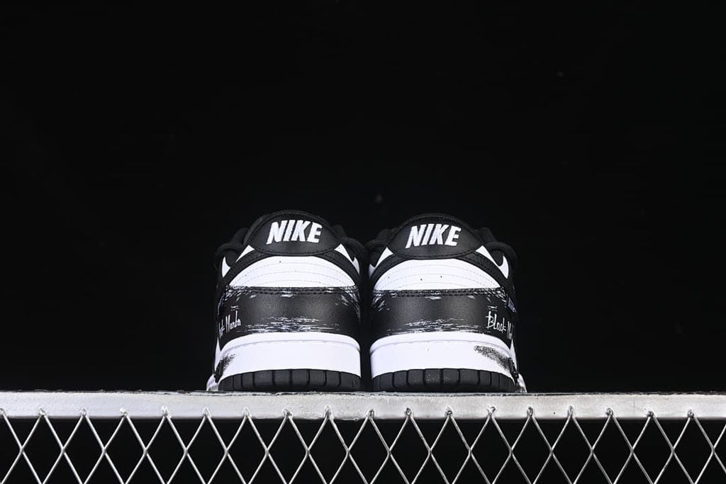 Rear view of both shoes showing heel panels and outsoles
