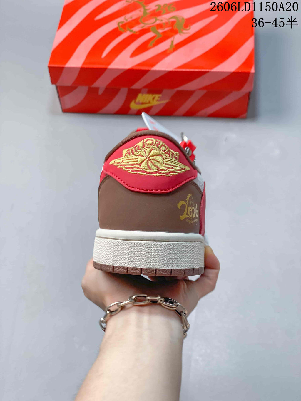 Rear view showing the red heel tab and brown heel panel.