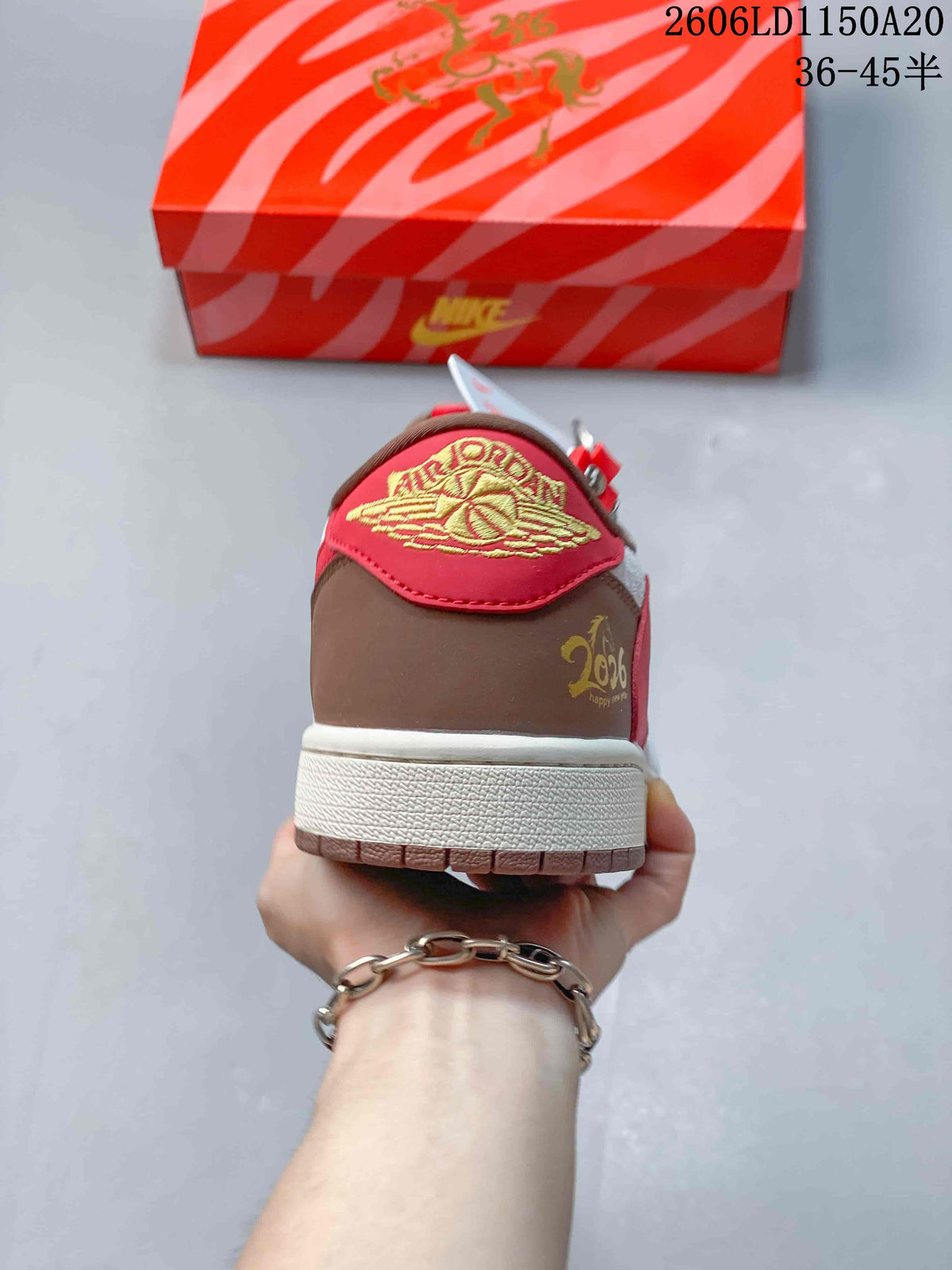Rear view showing the red heel tab and brown heel panel.