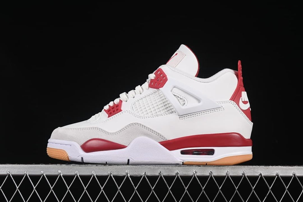 Side profile of a white and red sneaker
