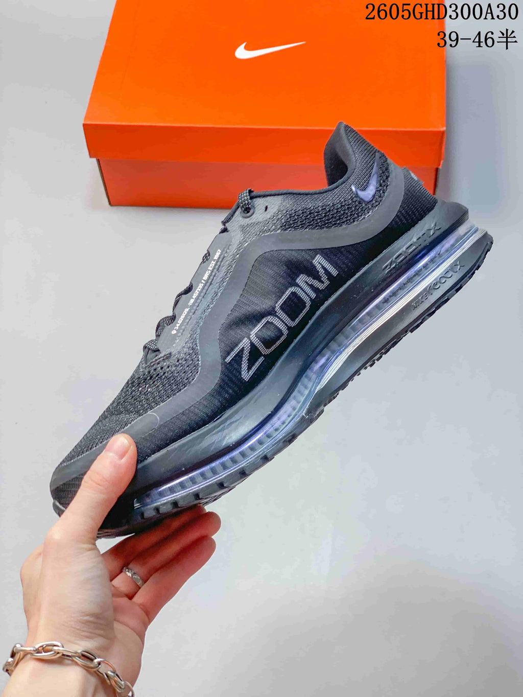 Side view of a charcoal Pegasus Premium shoe with a layered upper and cushioned sole.