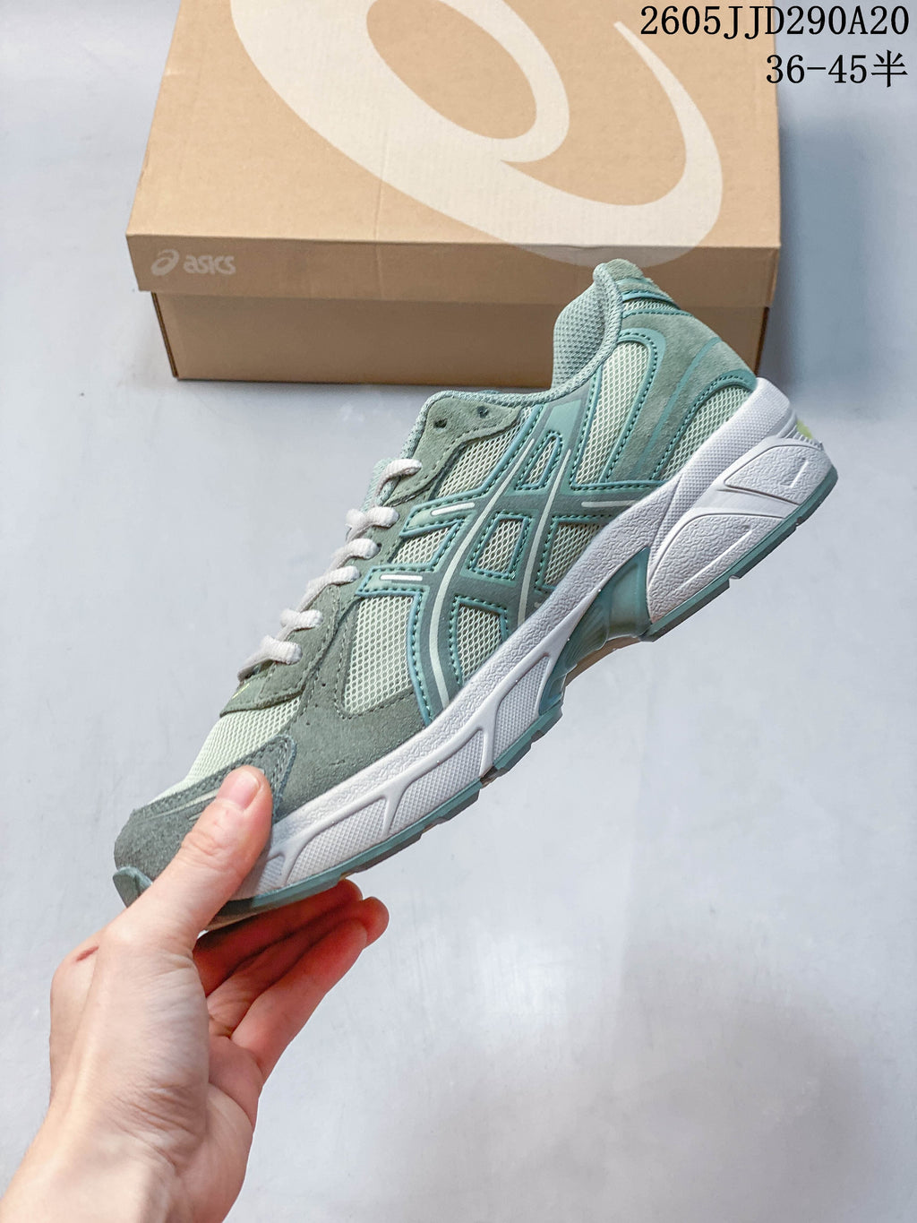 Side profile of a sage-green ASICS GEL-1130 sneaker