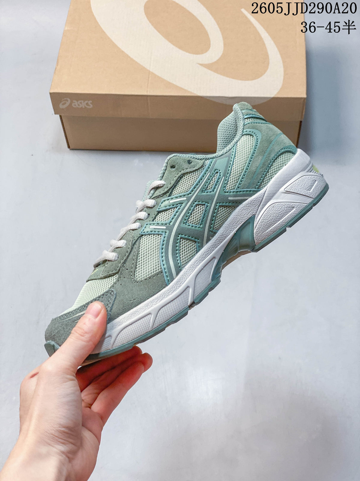 Side profile of a sage-green ASICS GEL-1130 sneaker