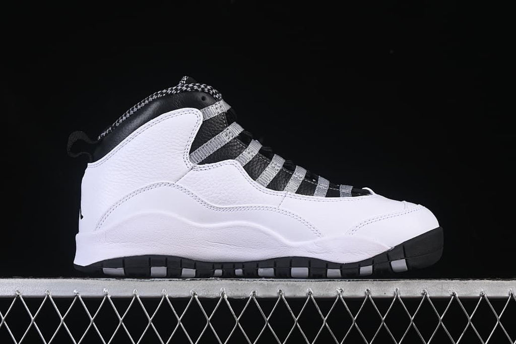 Side profile of the white high-top sneaker with black and grey accents