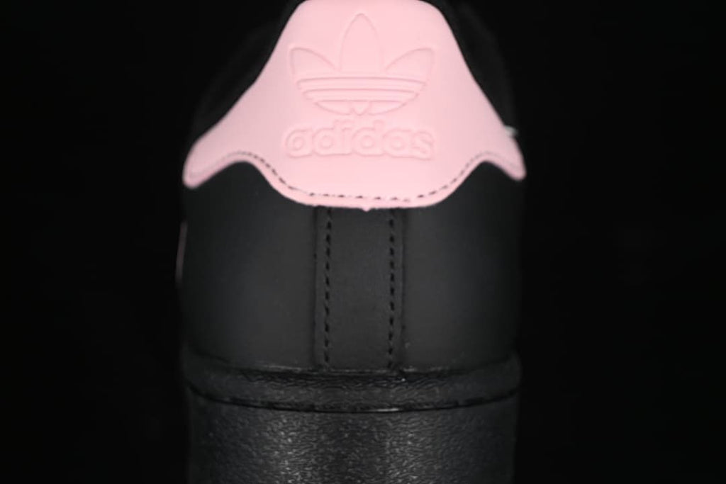 Rear view showing the pink heel tab and black heel panel