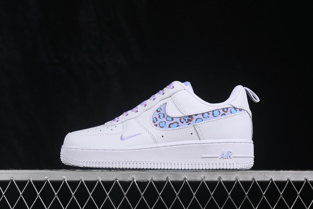 Side profile showing the white low-top silhouette and patterned Swoosh detail.