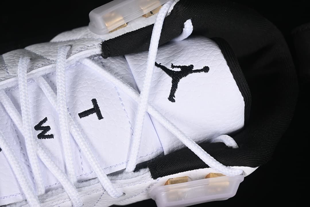 Detail of the tongue logo, laces, and translucent lace wings.