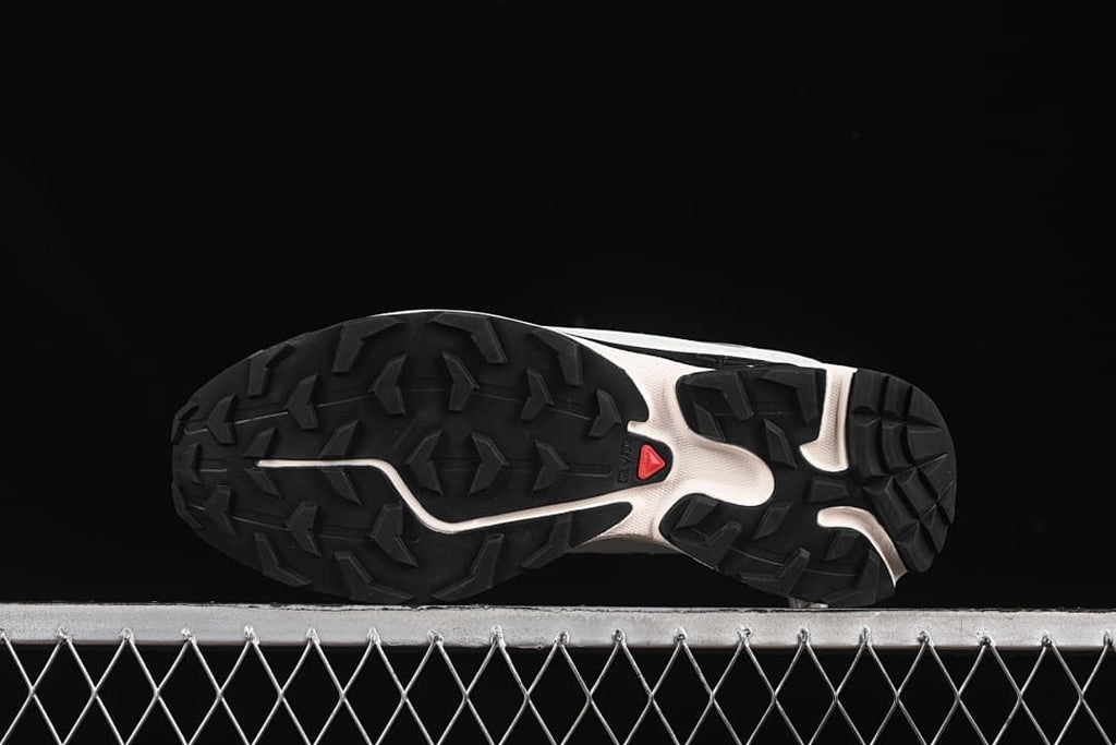 Underside view showing the black lugged outsole and center detailing.