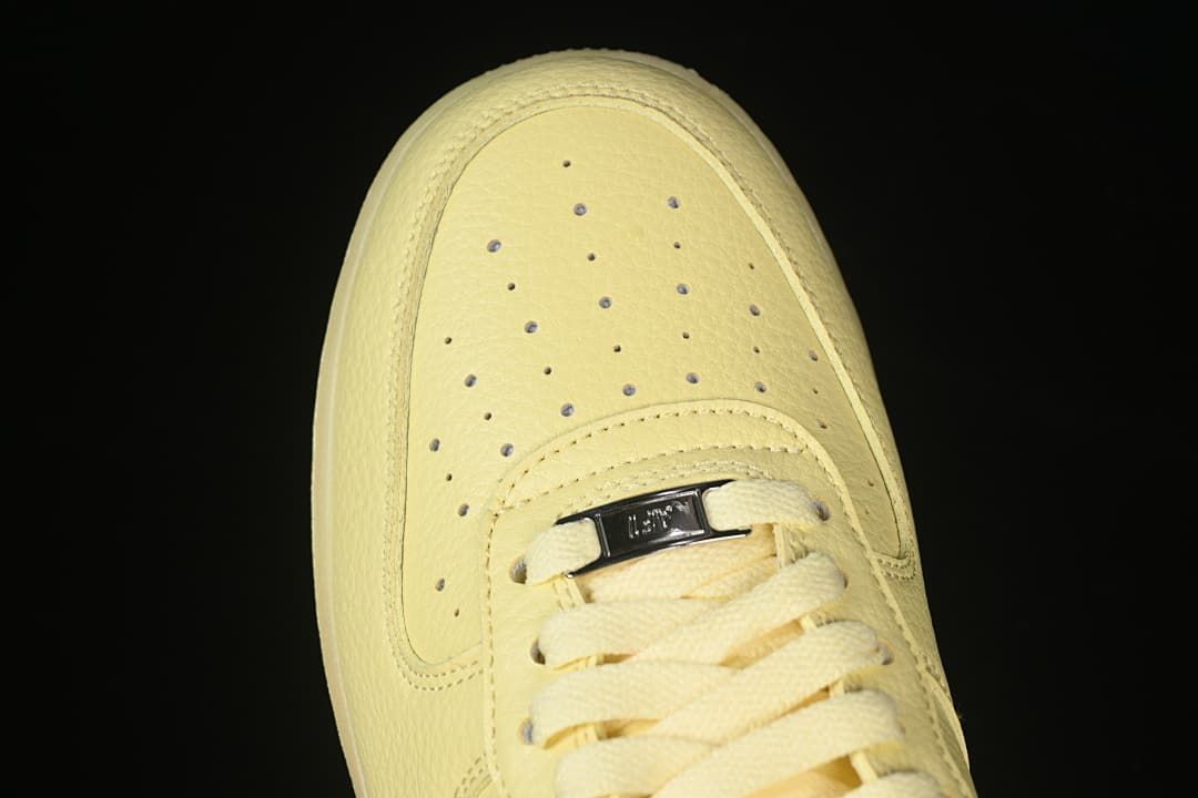 Top view of the perforated toe and lace area