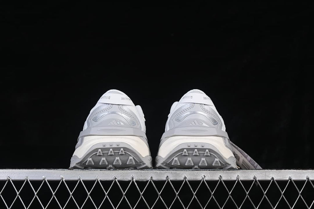 Rear view of the pair showing the heel and outsole details