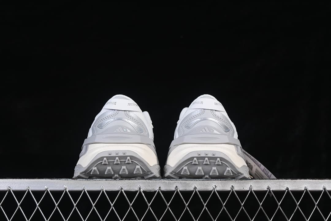Rear view of the pair showing the heel and outsole details