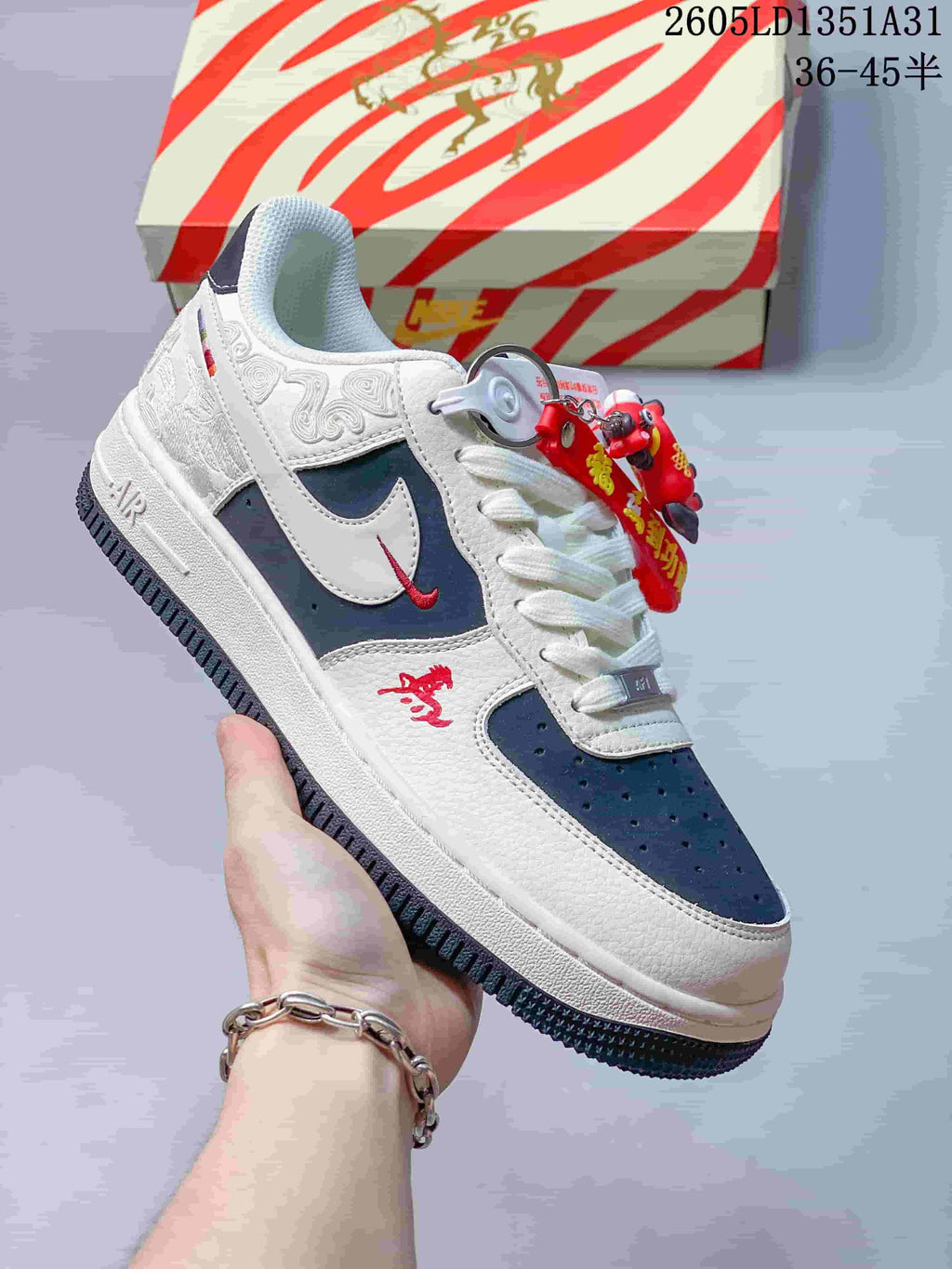 Angled side view highlighting the off-white and navy color blocking