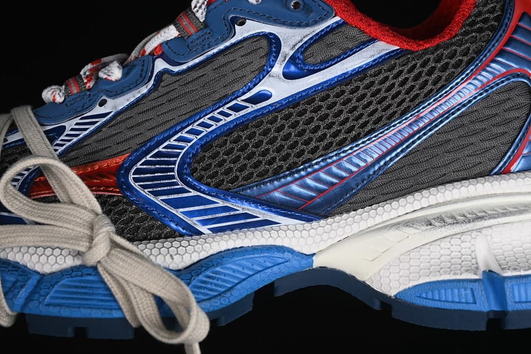 Close-up of the sneaker's layered grey and blue side panels