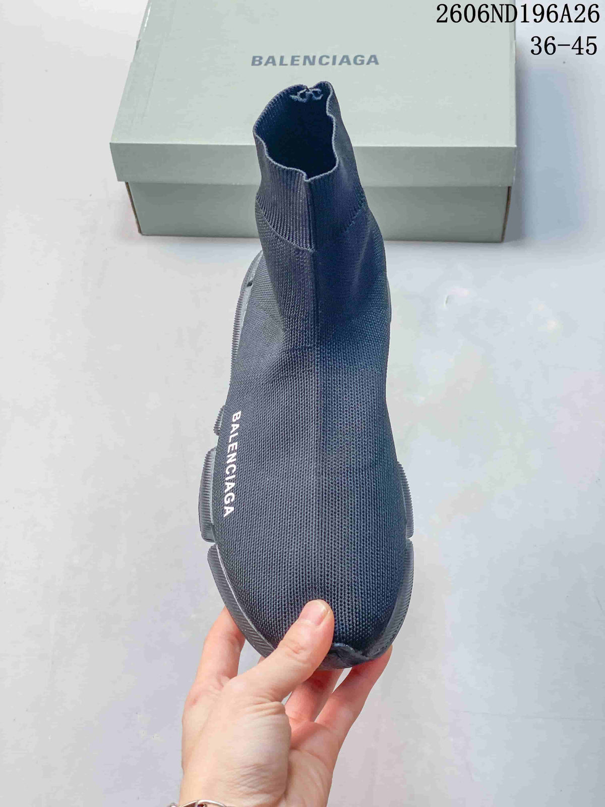 Top view of a charcoal grey sock-style sneaker with visible branding