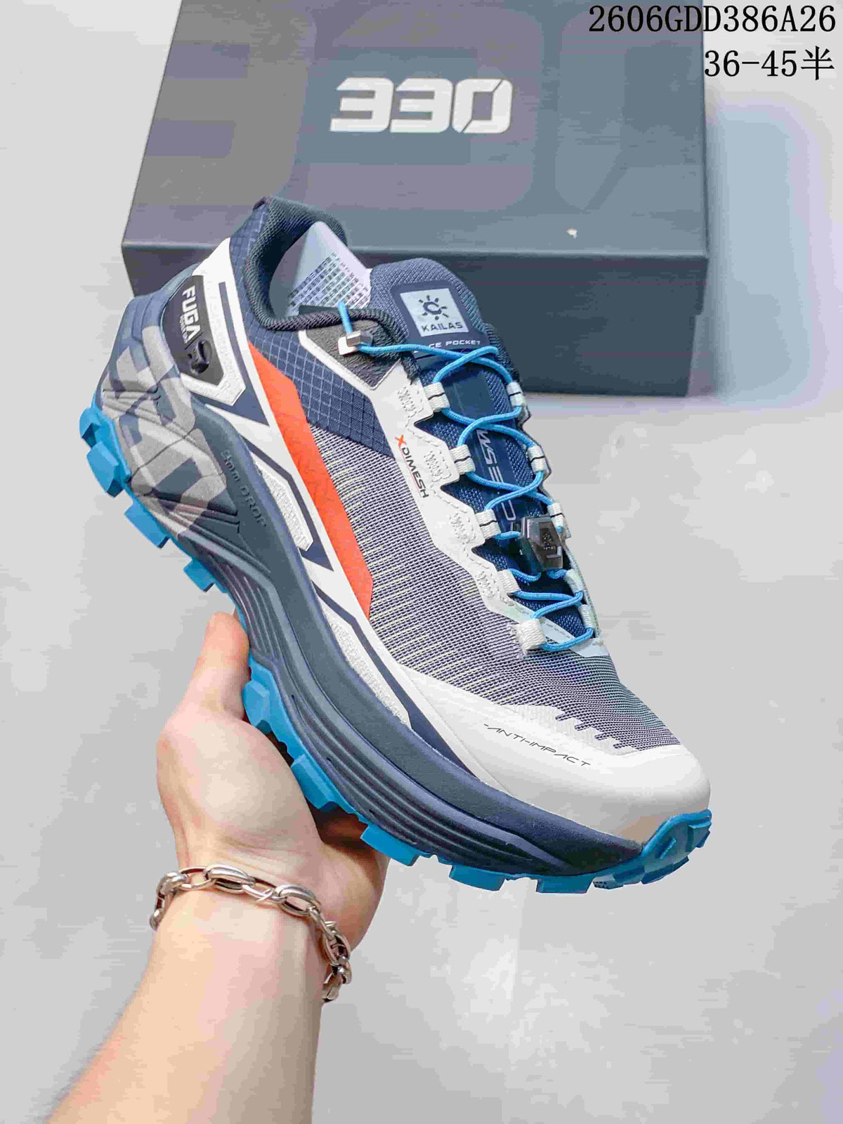 Side view of a gray and white KAILAS FUGA EX330 shoe with blue laces and turquoise outsole lugs