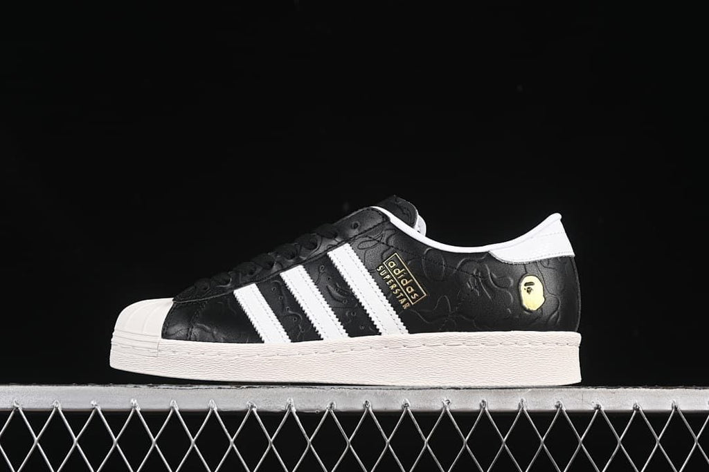 Side profile of the sneaker with white stripes and a gold-tone heel accent