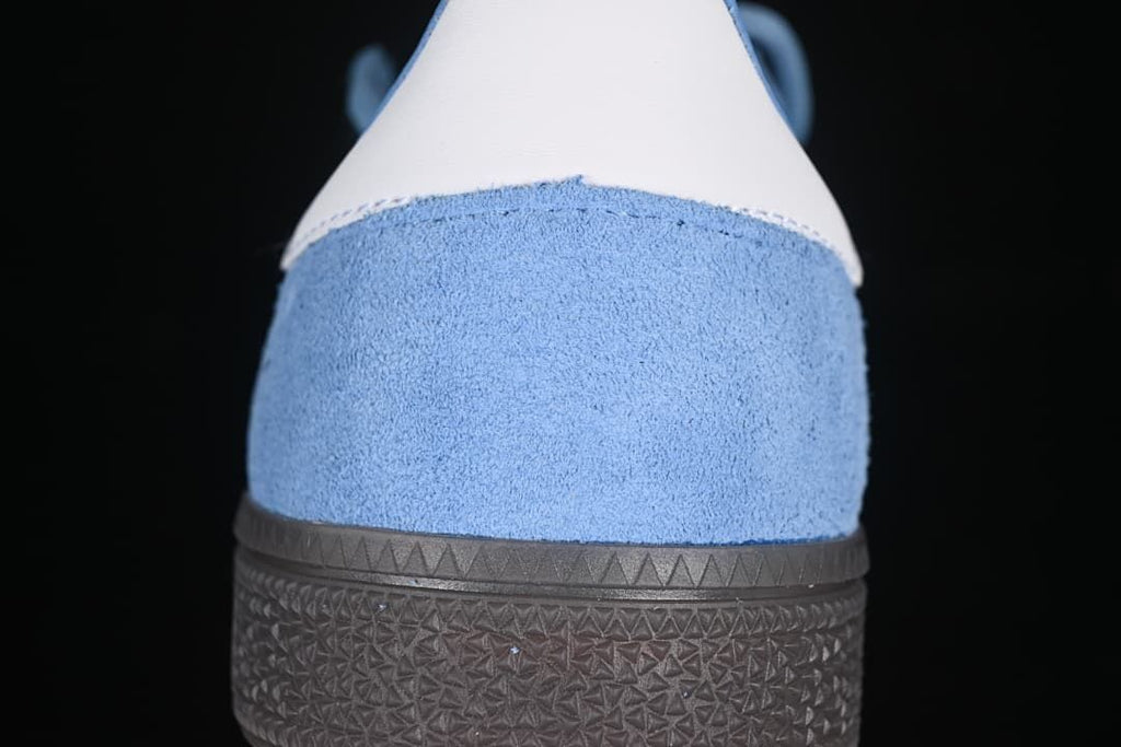 Rear view of the blue sneaker with a white heel tab and dark sole