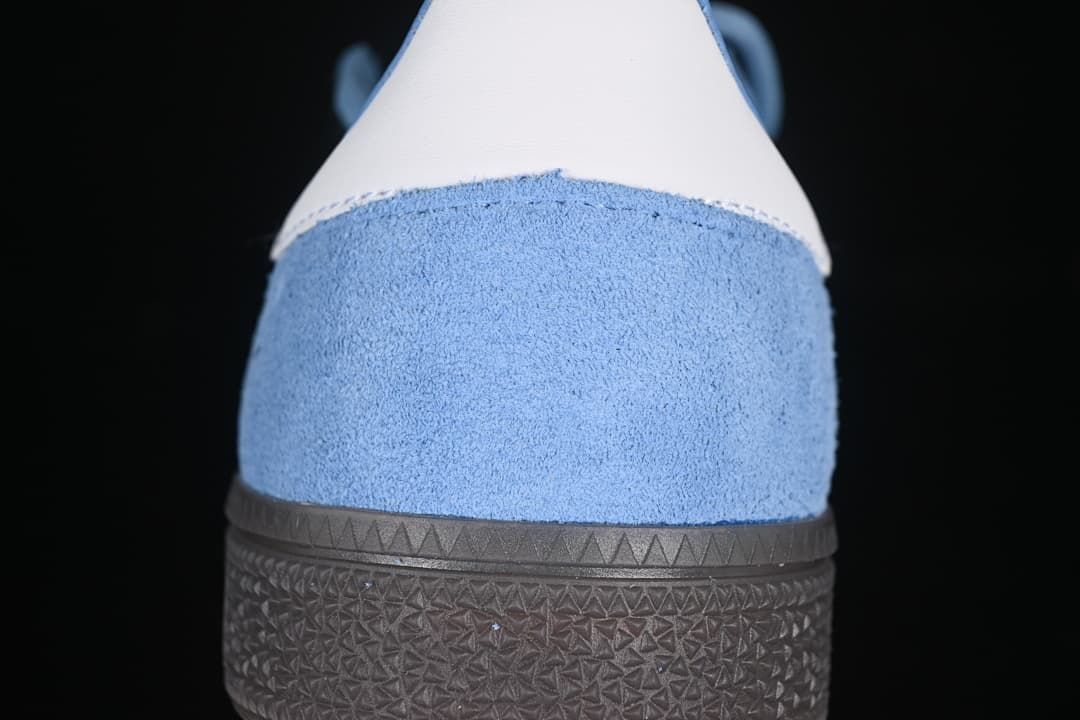 Rear view of the blue sneaker with a white heel tab and dark sole