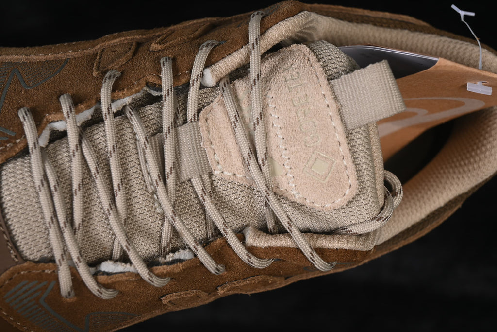 Close-up of the tongue, laces, and layered upper panels.