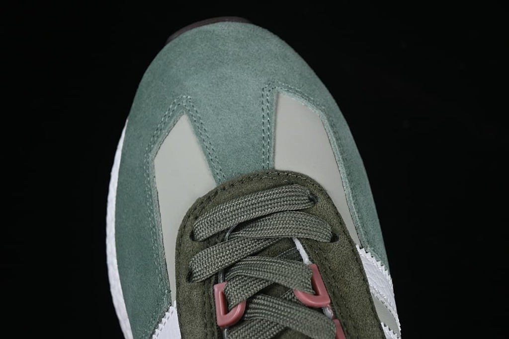 Top close-up of the green toe and lace area