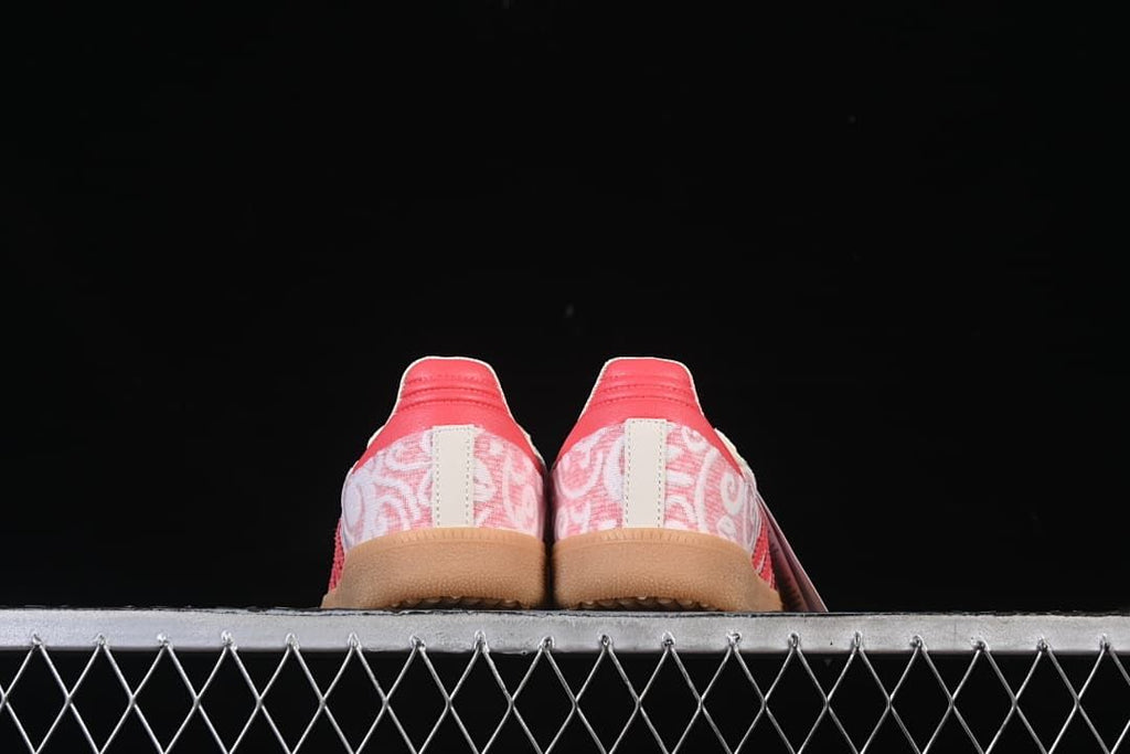 Rear view of the pair showing patterned heel panels and coral accents