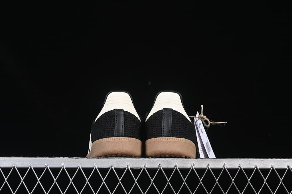Rear view of both sneakers showing their white heel panels