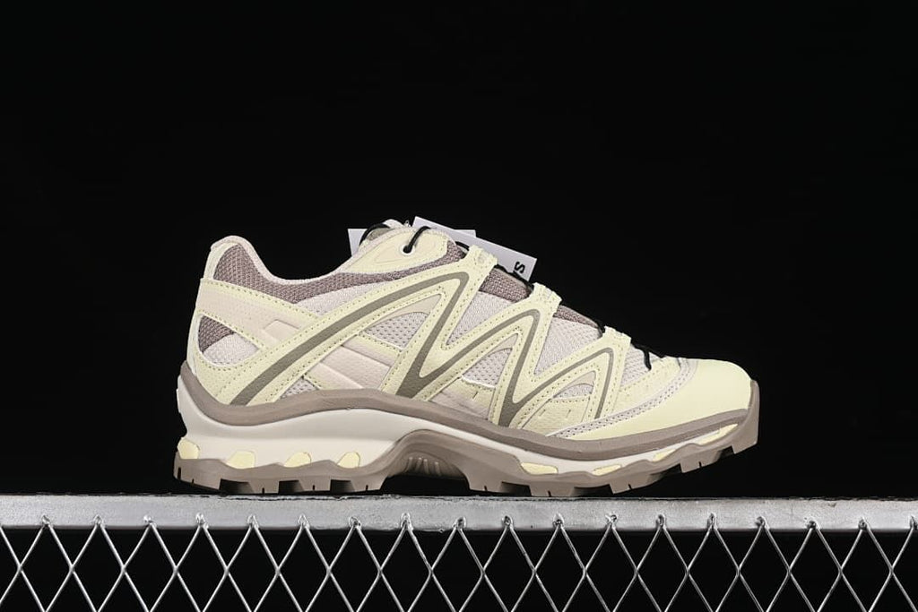 Side profile showing the layered upper and rugged outsole