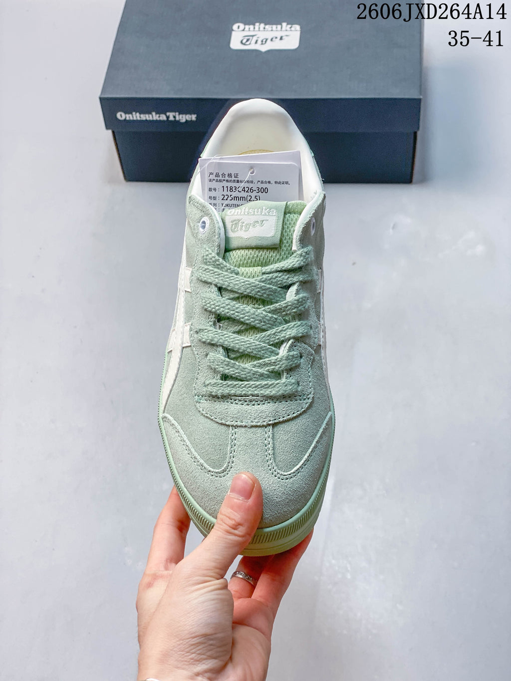 Top view of the mint green lace-up sneaker.