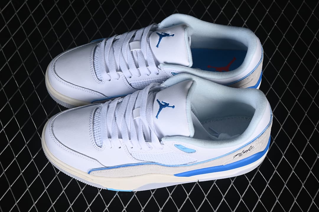Pair of white and blue sneakers shown from above