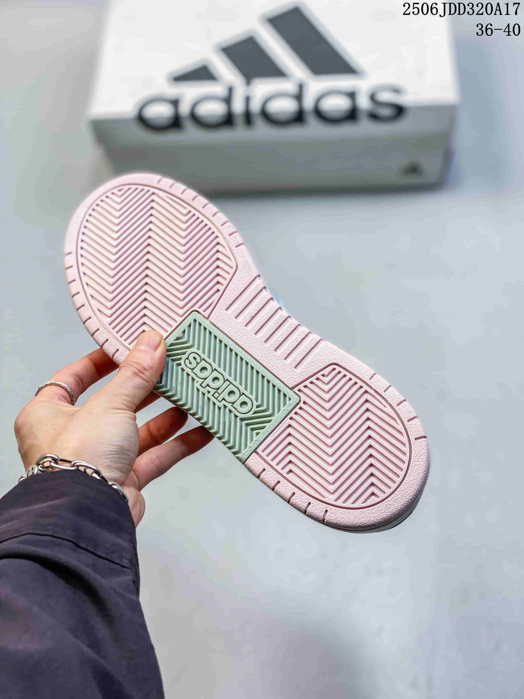 Close-up of the sneaker outsole showing patterned tread and pink and mint-colored sections.