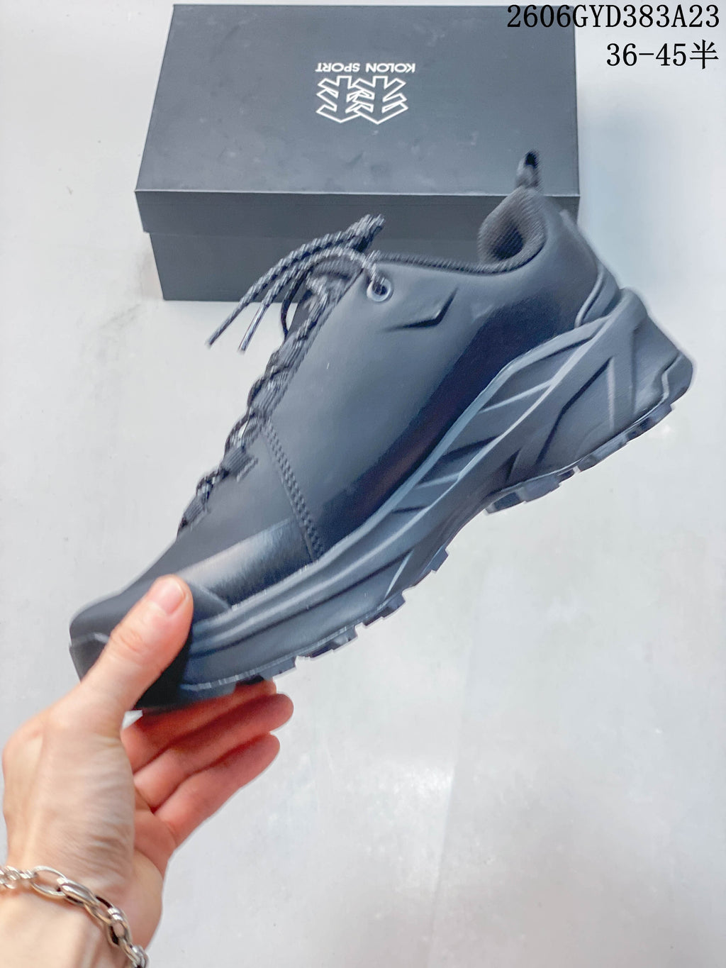 Side view of a dark gray Kolon Sport hiking sneaker
