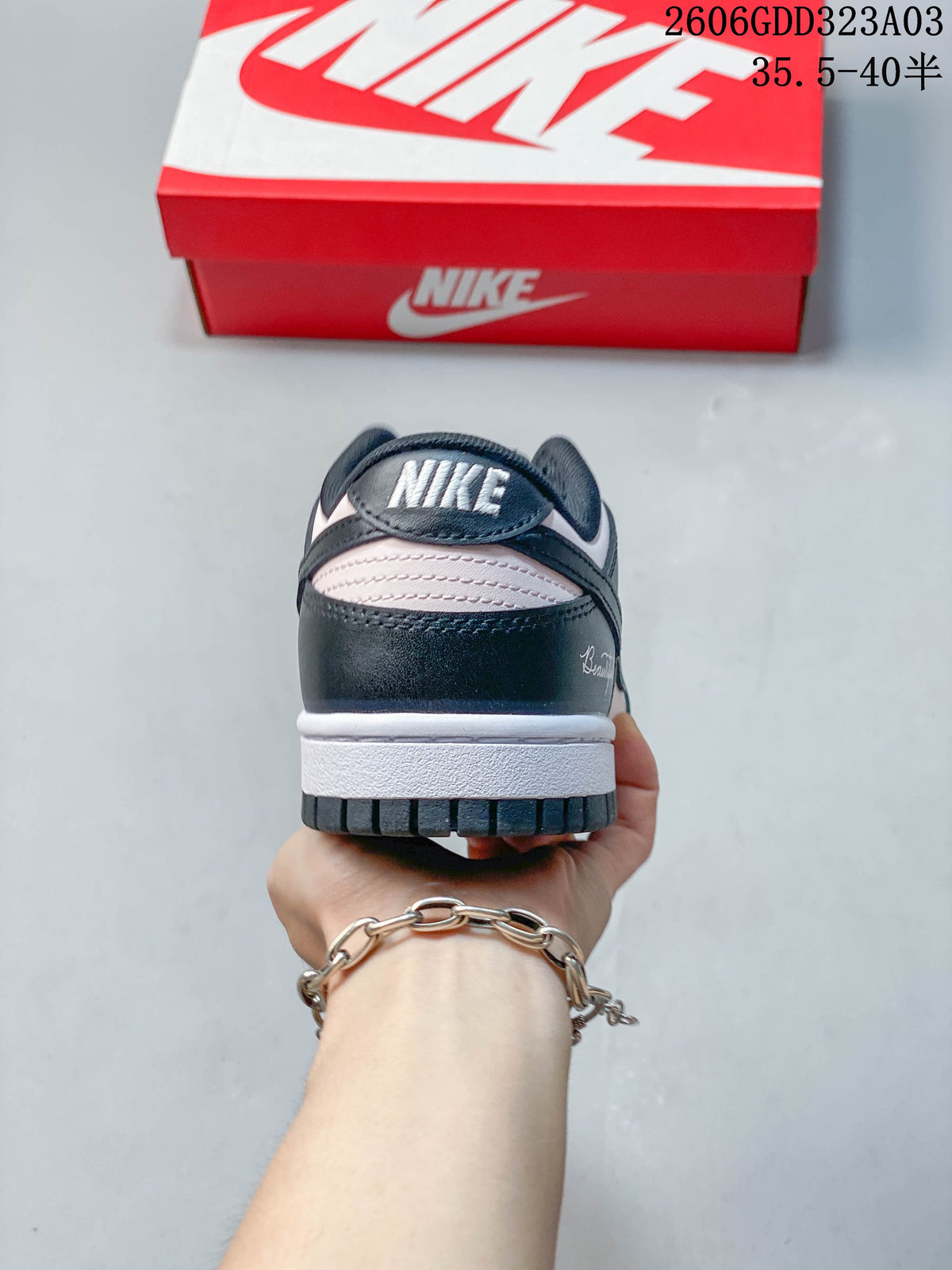 Rear view of the sneaker showing the heel panel and white midsole